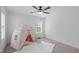 Bright bedroom featuring a faux play tent, plush rug, and a window with lots of natural light at 2408 Merion Creek Dr, Apex, NC 27539