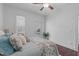 Bright bedroom with a comfortable bed, ample natural light, and access to an outdoor space at 2408 Merion Creek Dr, Apex, NC 27539