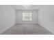 Empty bedroom featuring neutral carpet, ample space, and a chandelier light fixture at 2408 Merion Creek Dr, Apex, NC 27539