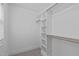 Walk-in closet with built-in shelving and clothing rods for optimal organization at 2408 Merion Creek Dr, Apex, NC 27539