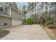 Exterior angle view of the home's garage, driveway, and basketball court at 2408 Merion Creek Dr, Apex, NC 27539