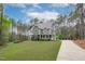 Charming two-story home with a long driveway and landscaped front yard at 2408 Merion Creek Dr, Apex, NC 27539