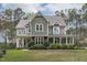 Attractive two-story home with a welcoming front porch and manicured landscaping at 2408 Merion Creek Dr, Apex, NC 27539