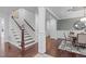 Elegant foyer with hardwood floors, white wainscoting, and staircase at 2408 Merion Creek Dr, Apex, NC 27539