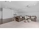 Cozy living room with hardwood floors, plush sofas, and unique ottomans at 2408 Merion Creek Dr, Apex, NC 27539