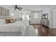 Main bedroom with connected seating area and hardwood floors at 2408 Merion Creek Dr, Apex, NC 27539