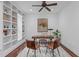 Cozy office with built-in shelves, wood floors, and an eye-catching chandelier at 2408 Merion Creek Dr, Apex, NC 27539