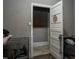 View from a doorway into a room with a dog crate and dog at 257 E Raleigh Blvd, Rocky Mount, NC 27801