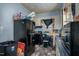 Kitchen featuring white cabinets, a black refrigerator, and black appliances at 257 E Raleigh Blvd, Rocky Mount, NC 27801