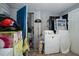 Laundry room with a dryer, storage shelves, and miscellaneous items at 257 E Raleigh Blvd, Rocky Mount, NC 27801