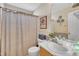 Bathroom featuring a vanity, toilet, and shower with curtain at 2604 Smoky Topaz Ln, Raleigh, NC 27610