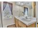 Bright bathroom with double sink vanity and large mirror offering ample counter space at 2604 Smoky Topaz Ln, Raleigh, NC 27610