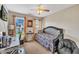 Well-lit bedroom with a comfortable bed and functional workspace at 2604 Smoky Topaz Ln, Raleigh, NC 27610