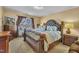 Primary bedroom with a large bed, and side tables, and big windows allowing natural light at 2604 Smoky Topaz Ln, Raleigh, NC 27610