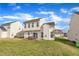 Exterior of two-story home featuring a wooden deck, white siding, and well-maintained lawn at 2604 Smoky Topaz Ln, Raleigh, NC 27610