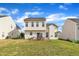 Exterior of two-story home featuring a wooden deck, white siding, and well-maintained lawn at 2604 Smoky Topaz Ln, Raleigh, NC 27610