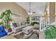 Comfortable living room with vaulted ceiling, plush seating, and a cozy fireplace at 2604 Smoky Topaz Ln, Raleigh, NC 27610