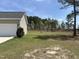 Large backyard with ample space for gardening, recreation, and outdoor gatherings at 27 Belmont Ct, Lillington, NC 27546