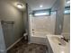 Bathroom featuring a shower-tub combo and single sink vanity at 27 Belmont Ct, Lillington, NC 27546