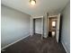 Bedroom featuring neutral colors and a closet, offering plenty of storage space at 27 Belmont Ct, Lillington, NC 27546