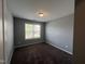Cozy bedroom with neutral paint, plush carpeting, and a window offering natural light at 27 Belmont Ct, Lillington, NC 27546