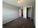 Neutral bedroom featuring a closet and carpeted floors at 27 Belmont Ct, Lillington, NC 27546