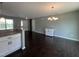 Open dining area featuring a modern chandelier and hardwood floors at 27 Belmont Ct, Lillington, NC 27546