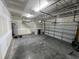 Spacious two-car garage with high ceilings, providing ample room for parking and storage at 27 Belmont Ct, Lillington, NC 27546