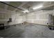 Spacious two-car garage with high ceilings, providing ample room for parking and storage at 27 Belmont Ct, Lillington, NC 27546