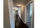Hallway with dark wood floors that connects to other areas of the home at 27 Belmont Ct, Lillington, NC 27546