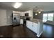 Modern kitchen featuring stainless steel appliances, granite countertops and white cabinetry at 27 Belmont Ct, Lillington, NC 27546