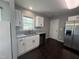 Well-lit kitchen featuring stainless steel appliances, granite countertops, and white cabinetry at 27 Belmont Ct, Lillington, NC 27546