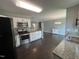 Updated kitchen features stainless appliances, granite countertops and an open view to the living spaces at 27 Belmont Ct, Lillington, NC 27546