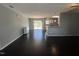 Bright living room with open floor plan, hardwood floors, and view to outdoor deck at 27 Belmont Ct, Lillington, NC 27546