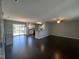 Spacious living room featuring an open floor plan with hardwood floors and lots of natural light at 27 Belmont Ct, Lillington, NC 27546