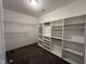 Spacious walk-in closet featuring custom shelving and ample storage space for clothing and accessories at 27 Belmont Ct, Lillington, NC 27546