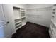 Spacious walk-in closet featuring custom shelving and ample storage space for clothing and accessories at 27 Belmont Ct, Lillington, NC 27546