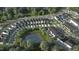 Aerial view showcases a well-planned community with houses, streets, and a central water feature at 817 Central Pk Dr, Raleigh, NC 27604