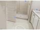 Bathroom featuring tile flooring, a glass-enclosed shower, and a white vanity with modern fixtures at 817 Central Pk Dr, Raleigh, NC 27604