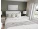 Serene bedroom featuring a bed with neutral bedding, bedside tables, and a window with natural light at 817 Central Pk Dr, Raleigh, NC 27604