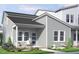 Charming home featuring a welcoming front porch, neutral siding, white trim and a beautifully landscaped front yard at 817 Central Pk Dr, Raleigh, NC 27604