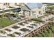 Aerial view of home gardens with a garage, an outdoor sitting area, and beautiful greenery at 817 Central Pk Dr, Raleigh, NC 27604