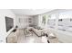 Bright living room with contemporary furnishings, large windows, and a comfortable sectional sofa at 817 Central Pk Dr, Raleigh, NC 27604