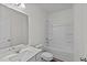 Bathroom featuring a shower over tub, vanity with granite counter, and modern fixtures at 308 Arch Canyon Cir, Zebulon, NC 27597