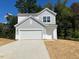 Charming two-story home with a two-car garage and landscaped yard at 308 Arch Canyon Cir, Zebulon, NC 27597