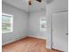 A bedroom features laminate floors, multiple bright windows and neutral wall paint at 312 E Highland Ave, Rocky Mount, NC 27801