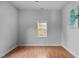 A bedroom features laminate floors, a bright window and neutral wall paint at 312 E Highland Ave, Rocky Mount, NC 27801