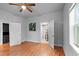 Spacious bedroom featuring hardwood floors, ceiling fan, and a bright window at 312 E Highland Ave, Rocky Mount, NC 27801
