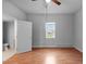 A bedroom features laminate floors, a bright window and a door to the bathroom at 312 E Highland Ave, Rocky Mount, NC 27801