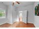 Bright bedroom featuring hardwood floors and natural light from a window at 312 E Highland Ave, Rocky Mount, NC 27801